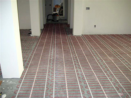 Radiant floor heating system being installed.